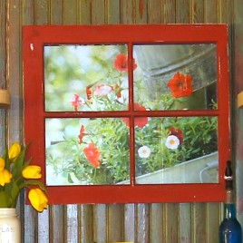 Old window frame with photo behind it.